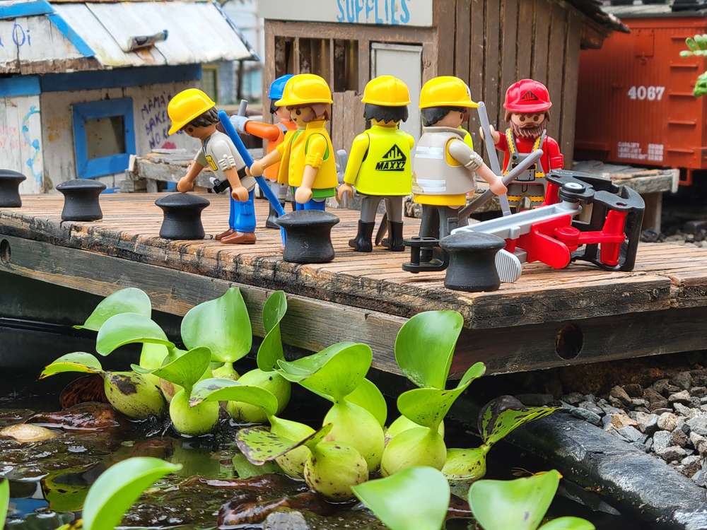 group of construction figures on a model dock