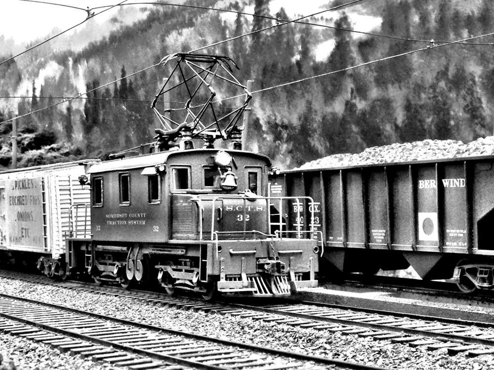 black and white photo of model electric engine on layout