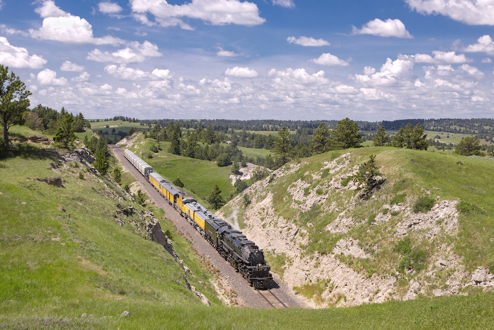 Big Boy steam locomotive approaches tunnel.