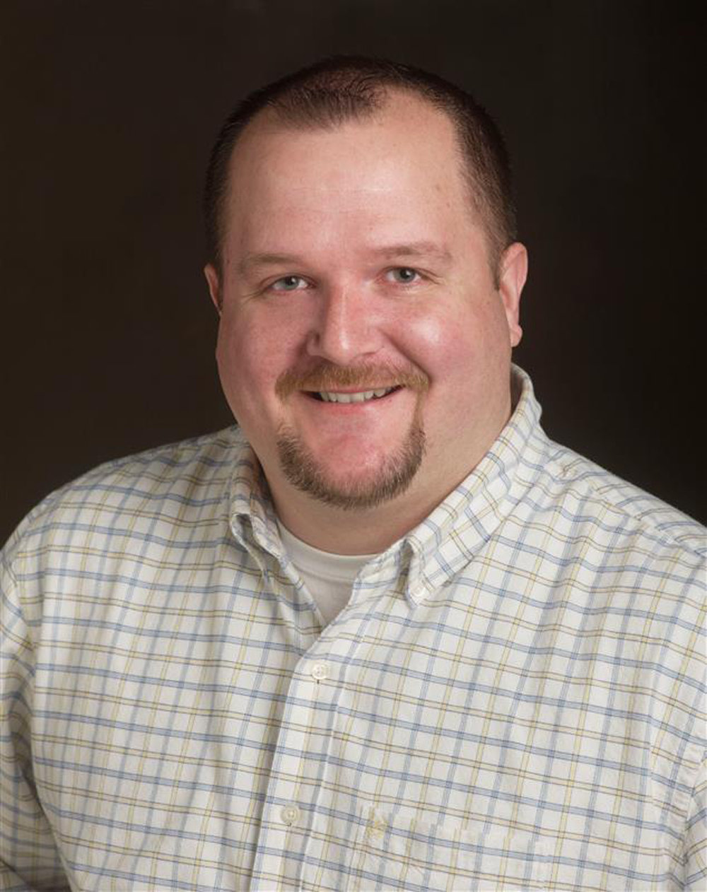 headshot of man smiling