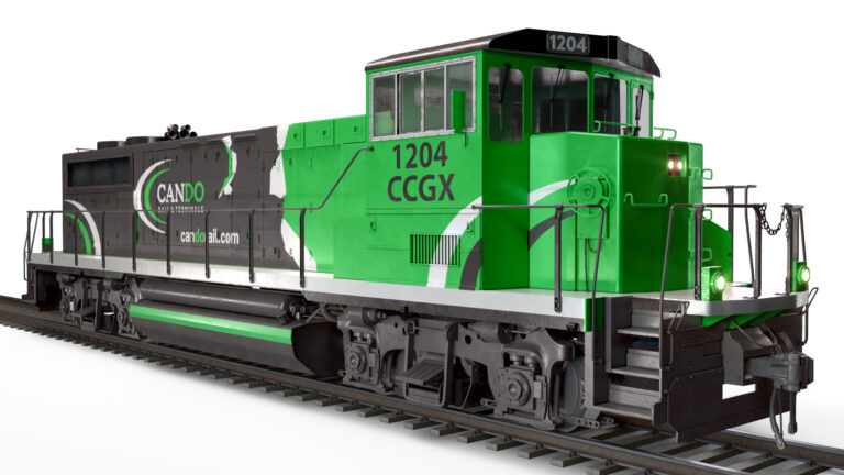 Green and gray switching locomotive with extended-height cab
