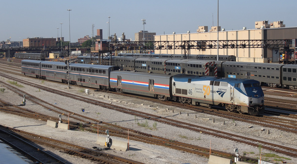 Passenger train with baggage car, diner, coach, and sleeper.