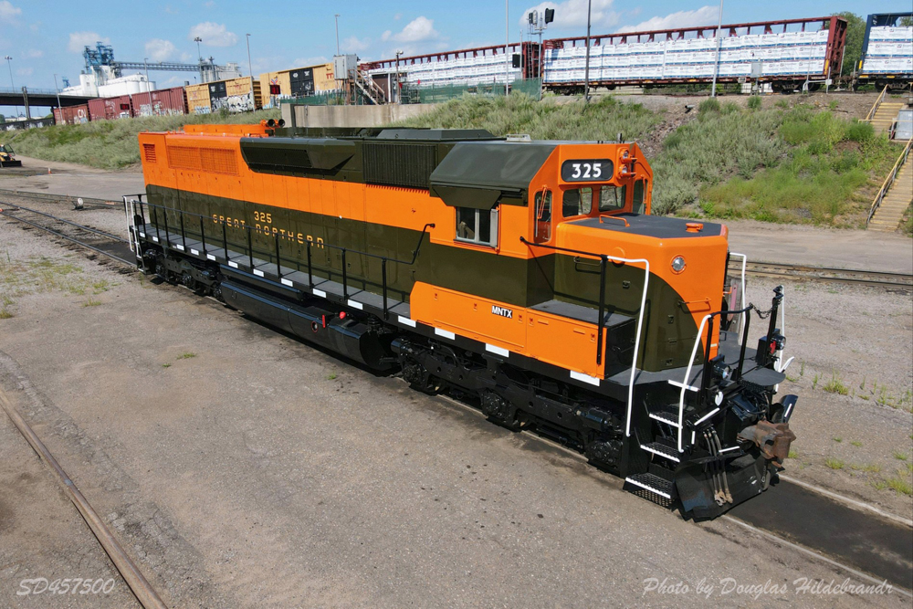 Green and orange diesel locomotive