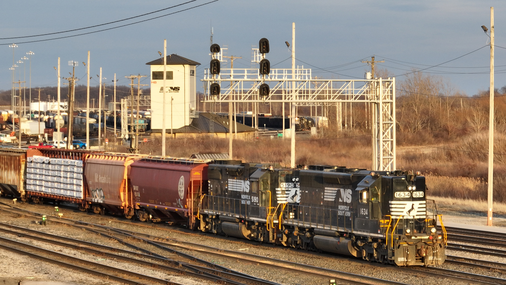 Black diesels with high short hoods work at yard