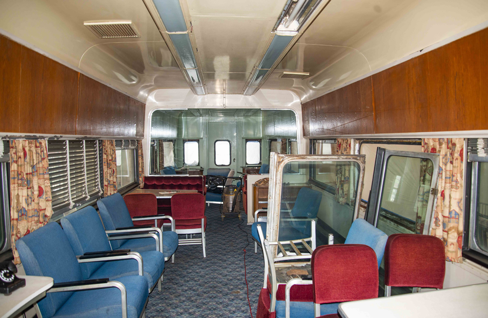 Interior of pasenger car, with some windows sitting inside