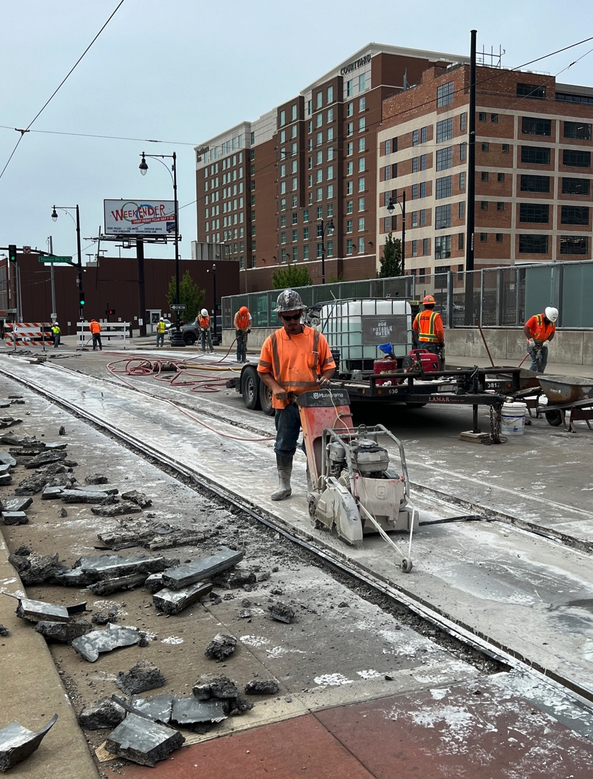 Workmen tearing up street