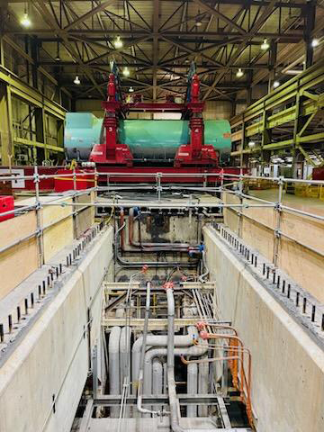 Interior of power plant with generator on crane
