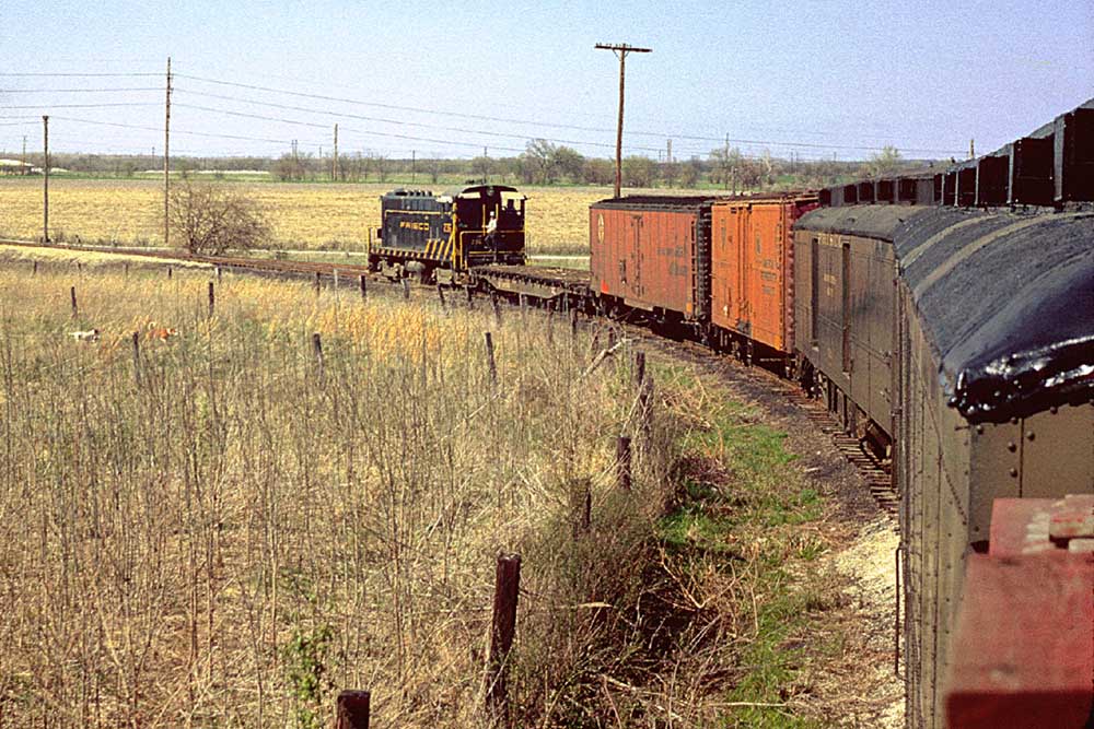 View along mixed train during Frisco caboose ride