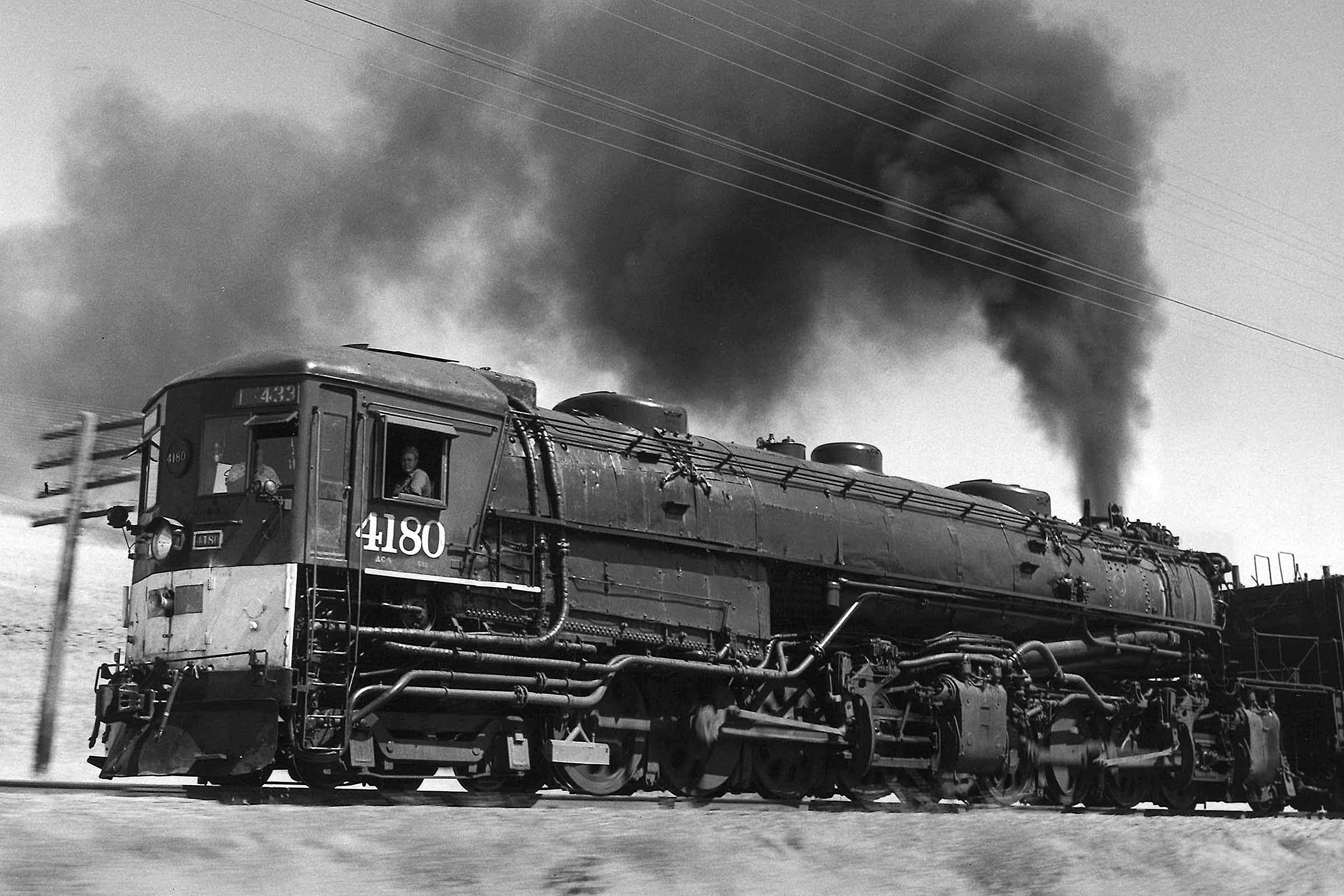 Freight train with smoking Southern Pacific cab-forwards