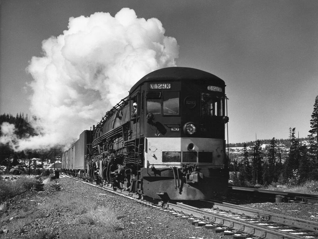 Freight train with smoking Southern Pacific cab-forwards