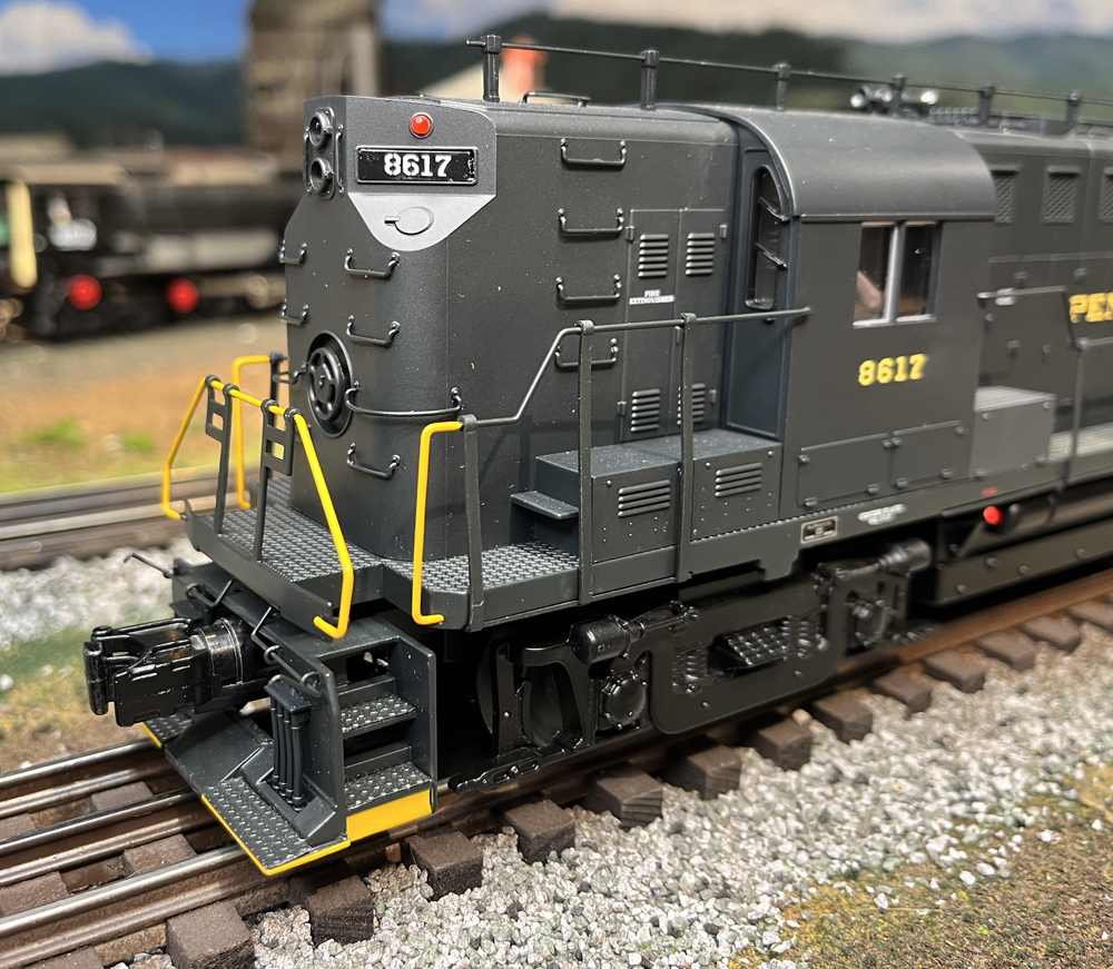 front of a dark green model engine
