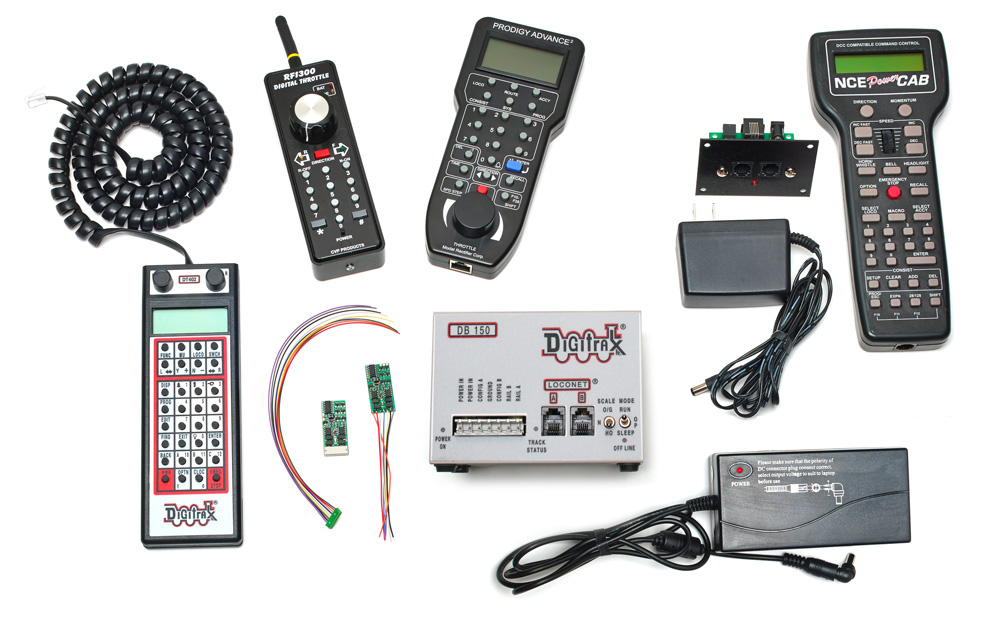 A collection of Digital Command Control system components on a white background