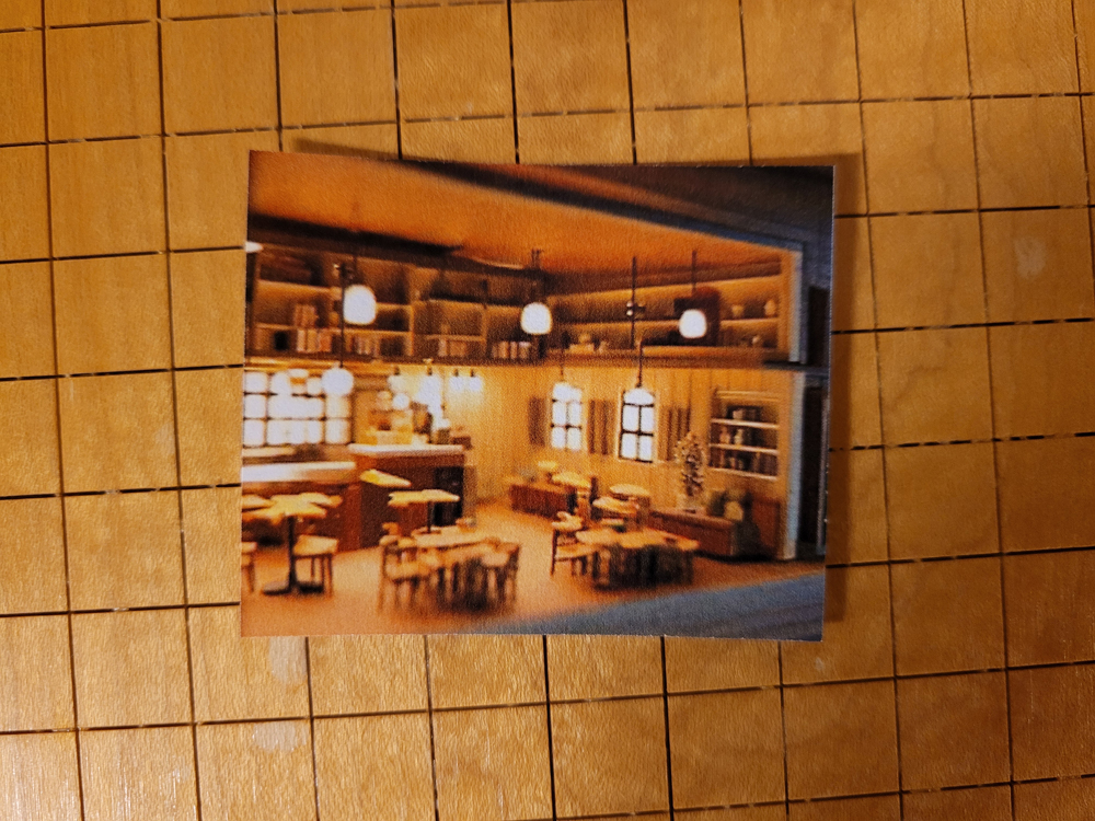 Designing structure interiors with artificial intelligence: An image of a printed AI generated image on a cutting table.