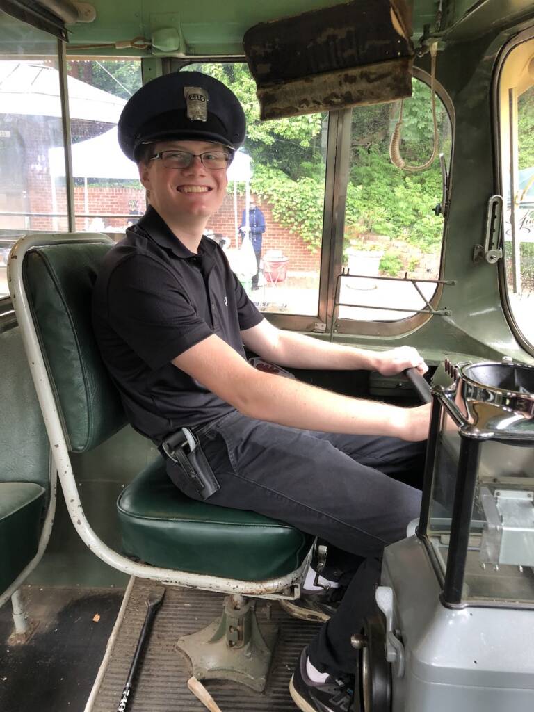 Young volunteer working on a trolley car.
