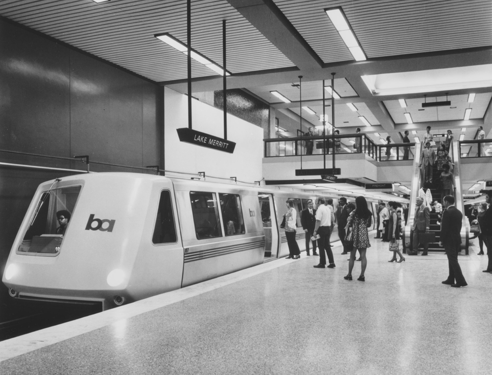 Black and white photo of rapid-transit equipment in underground station