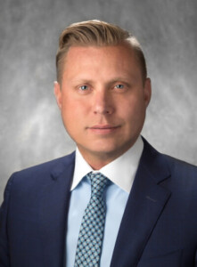 Head shot of man in blue blazer