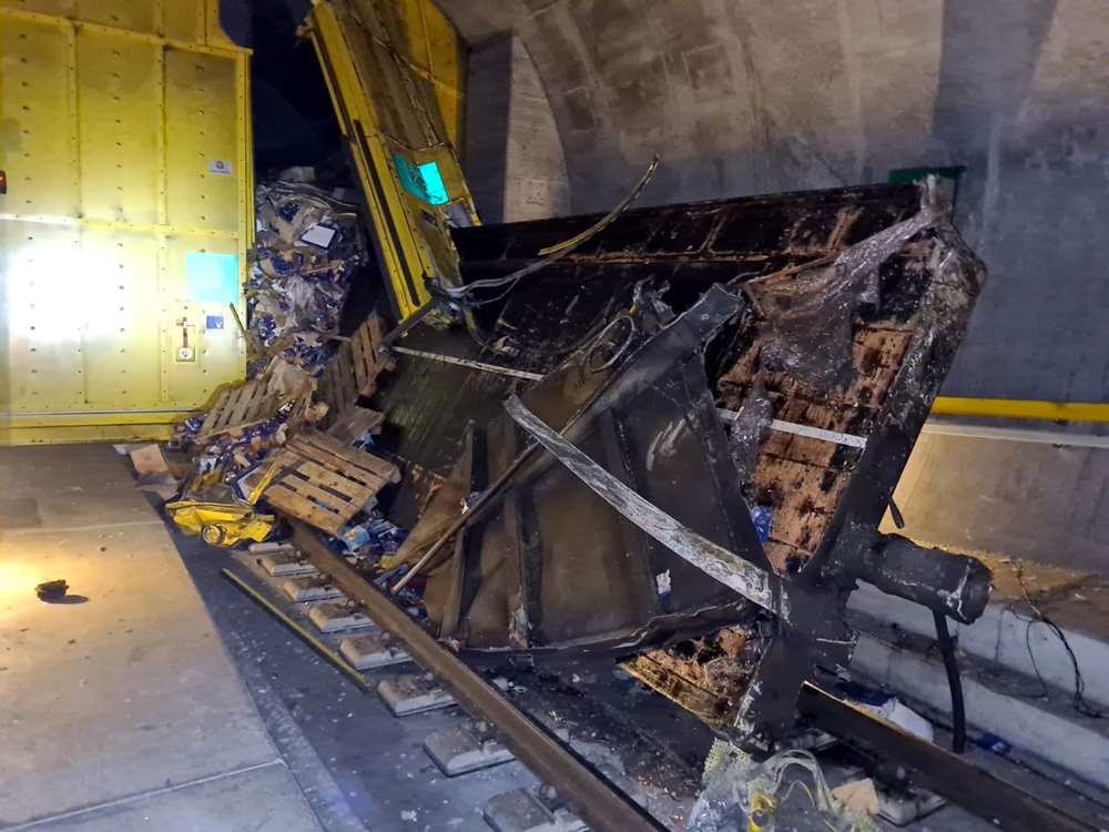 Damaged railcar and doors in tunnel