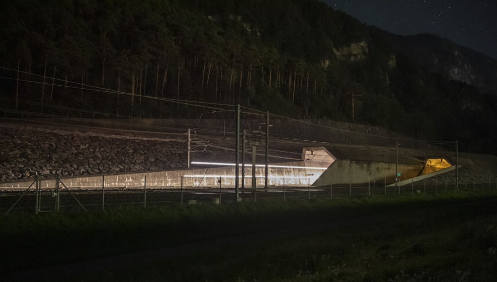 Headlights of train emerging from tunnel