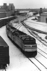 Amtrak Twin Cities services passenger train on curve in snow