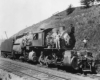 Men standing on Erie Railroad locomotives