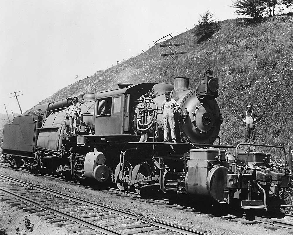 Men standing on Erie Railroad locomotives