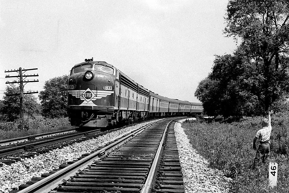 Two streamlined diesel Erie Railroad locomotives with passenger train on curve
