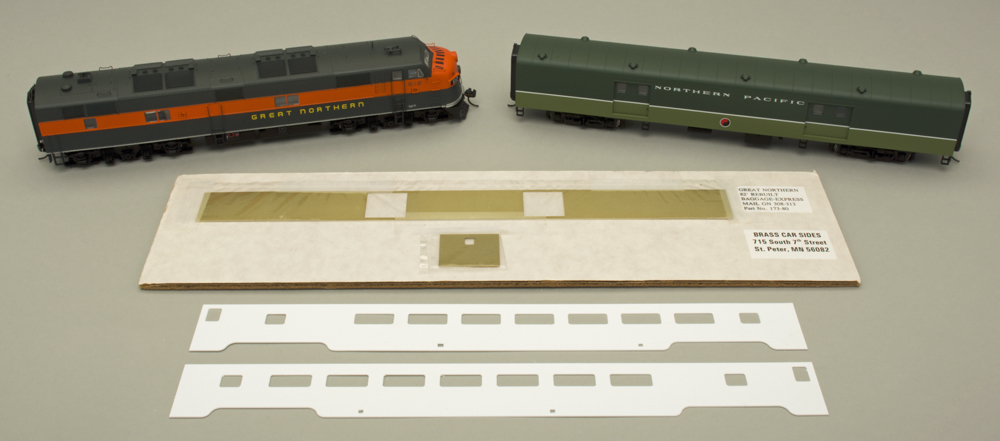 HO scale locomotive, lightweight baggage car, and car sides in brass and styrene.