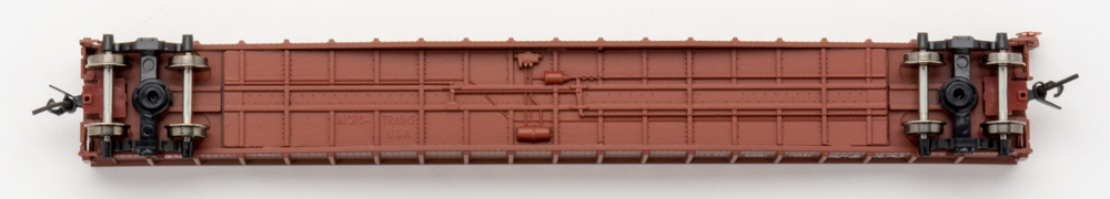Color photo showing underbody of N scale freight car.