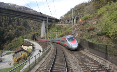 Silver and red aerodynamic, electric passenger train