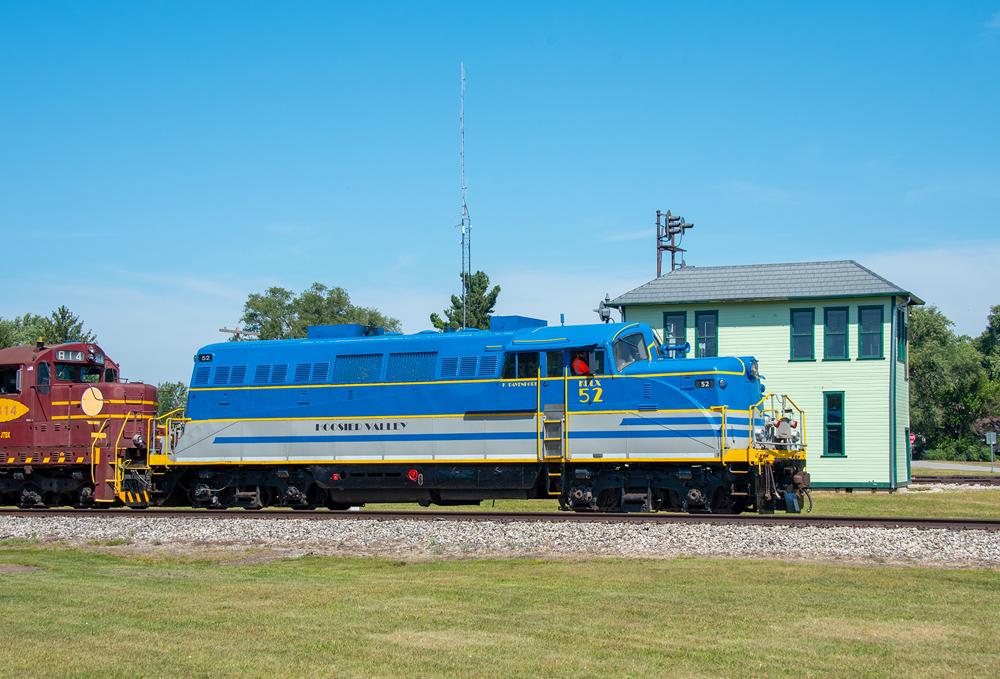 side of blue, yellow, and gray engine
