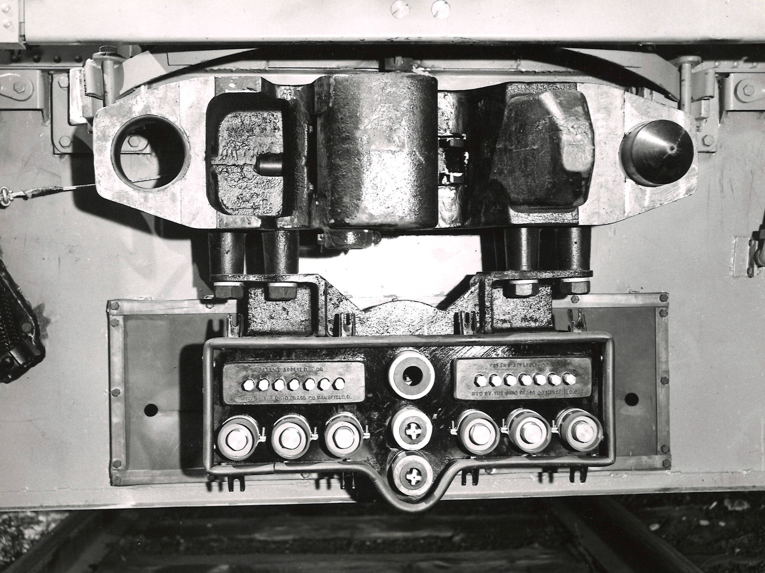Train coupler with alignment pins and special connections for air and electricity.