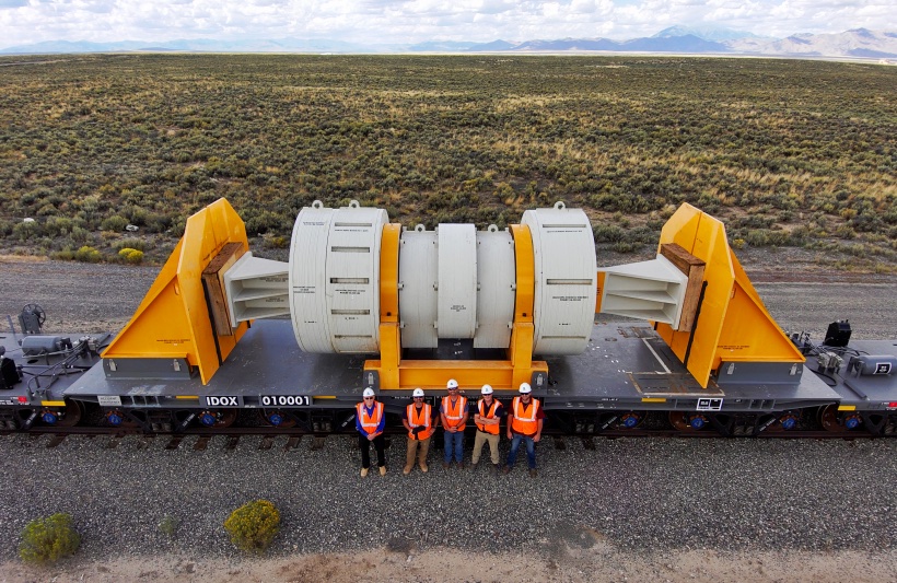 Group shot in front of specially designed railcar.