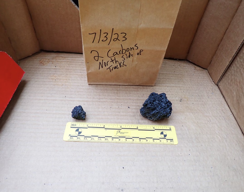Two emission particles in an evidence bin.