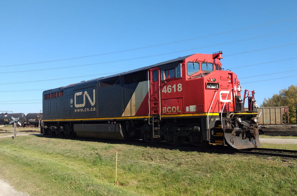 Red, white, and black cowl-unit locomotive