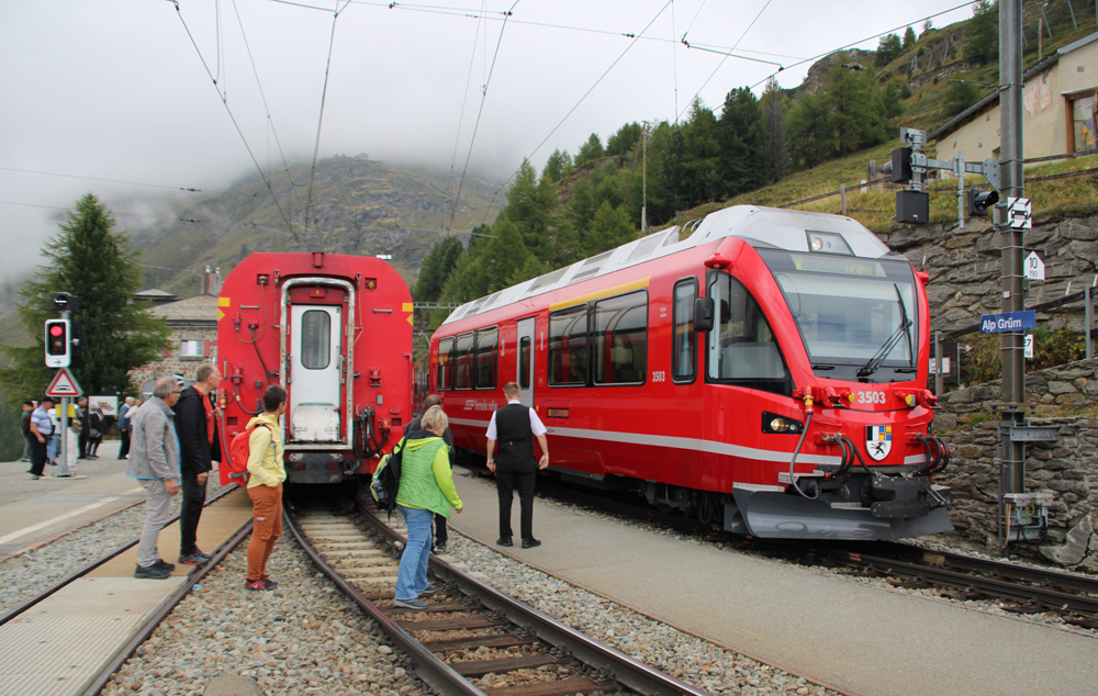 Two red trains meet