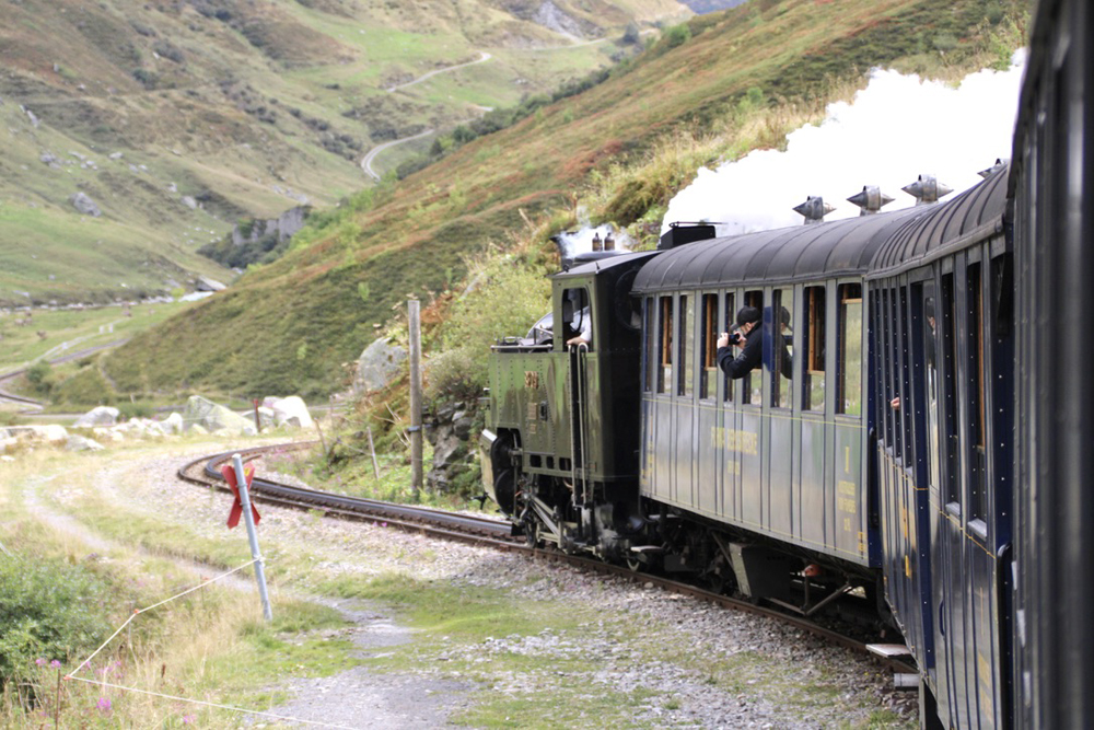 Steam train on winding pass