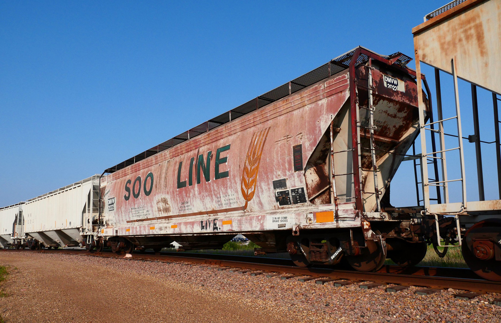 Rusty covered hopper car with Soo Line lettering