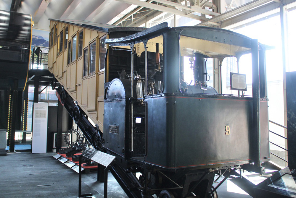 Cog railway car with attached steam locomotive