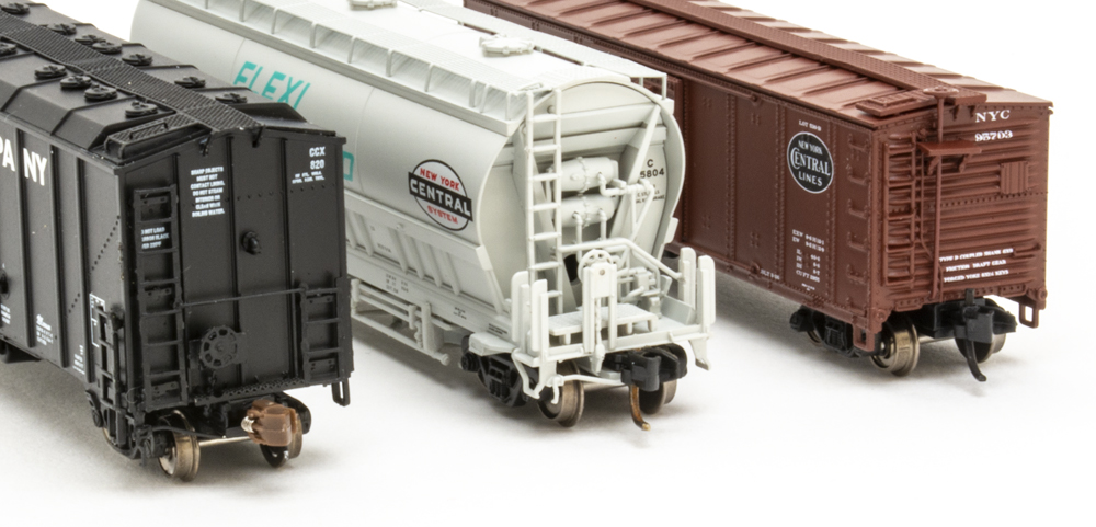 Color photo of three N scale freight cars.