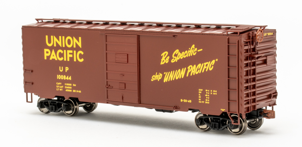 Color image of HO scale painted Synthetic Red with yellow graphics.