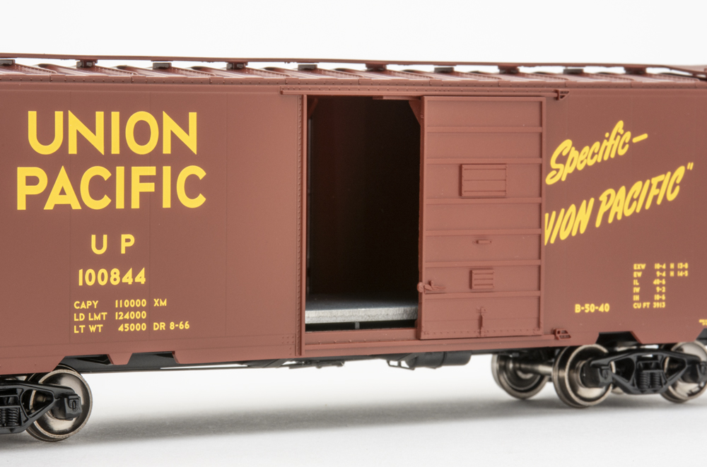 Color photo of HO scale boxcar with door open.