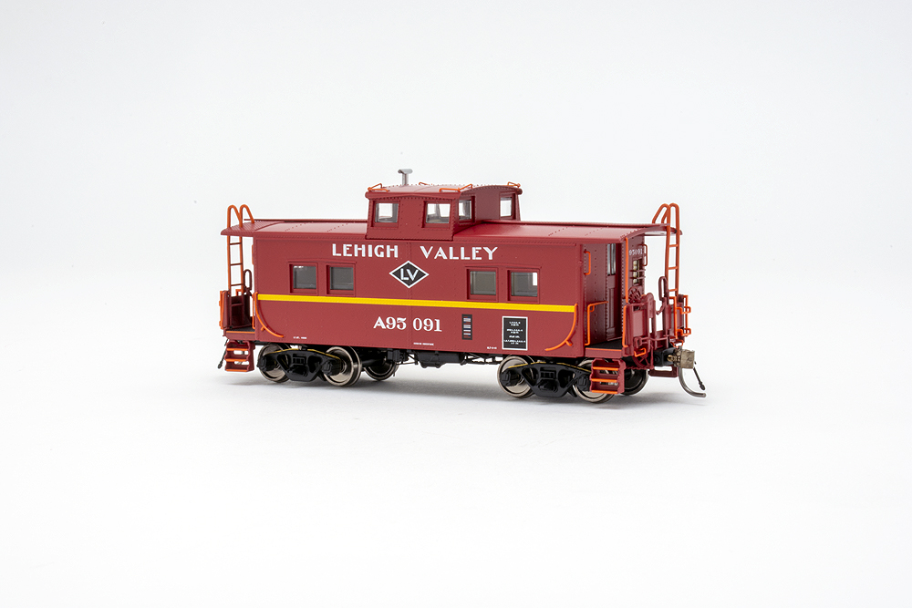 A bright red center-cupola caboose with four windows.