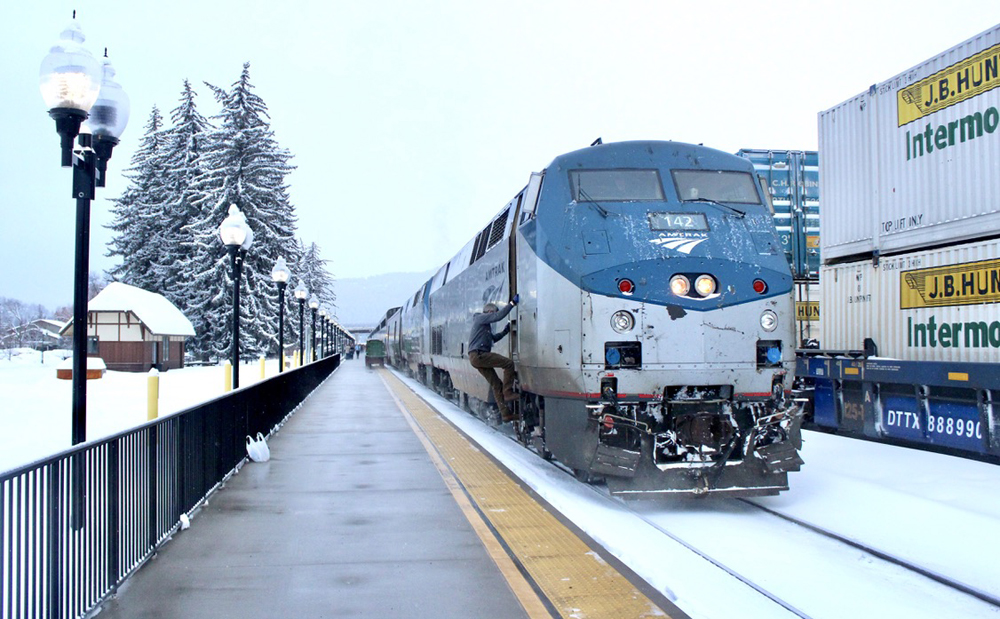 Passenger train stopped at station in snow