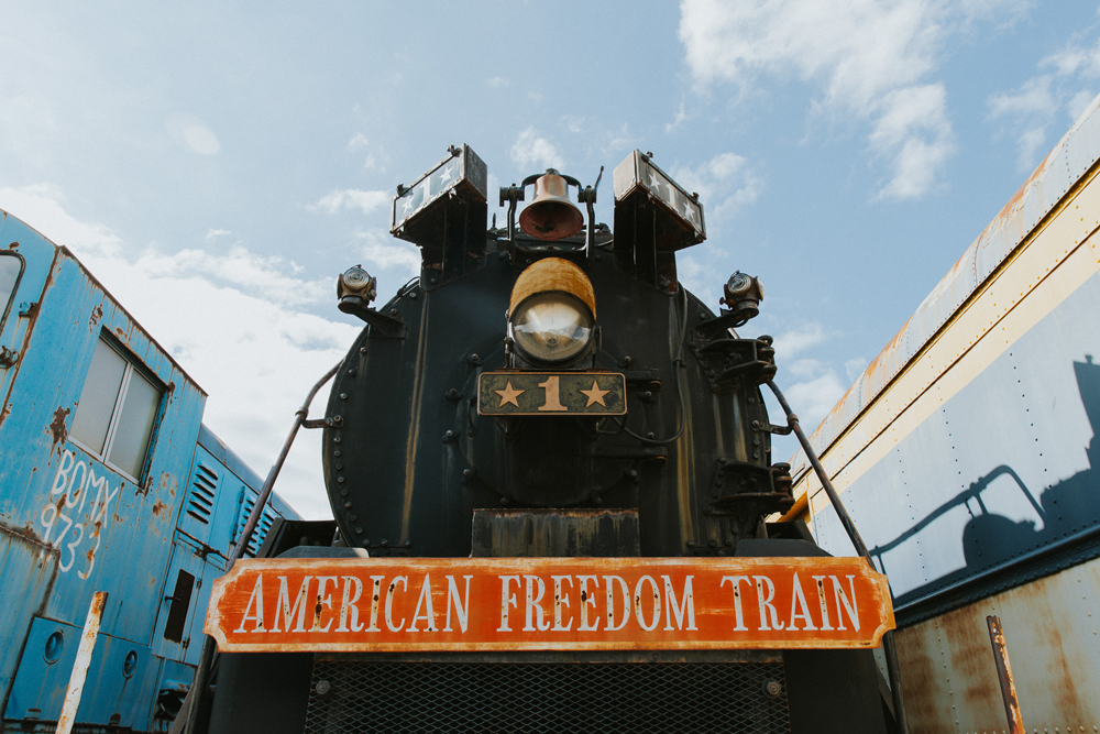 Front view of steam locomotive with "American Freedom Train" nameplate on front