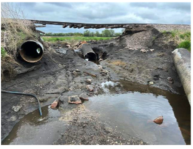 Track hanging unsupported over creek