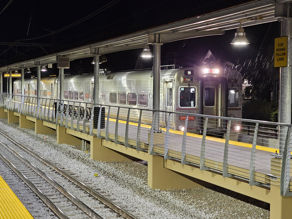 Electric multiple-unit trainset at station at night
