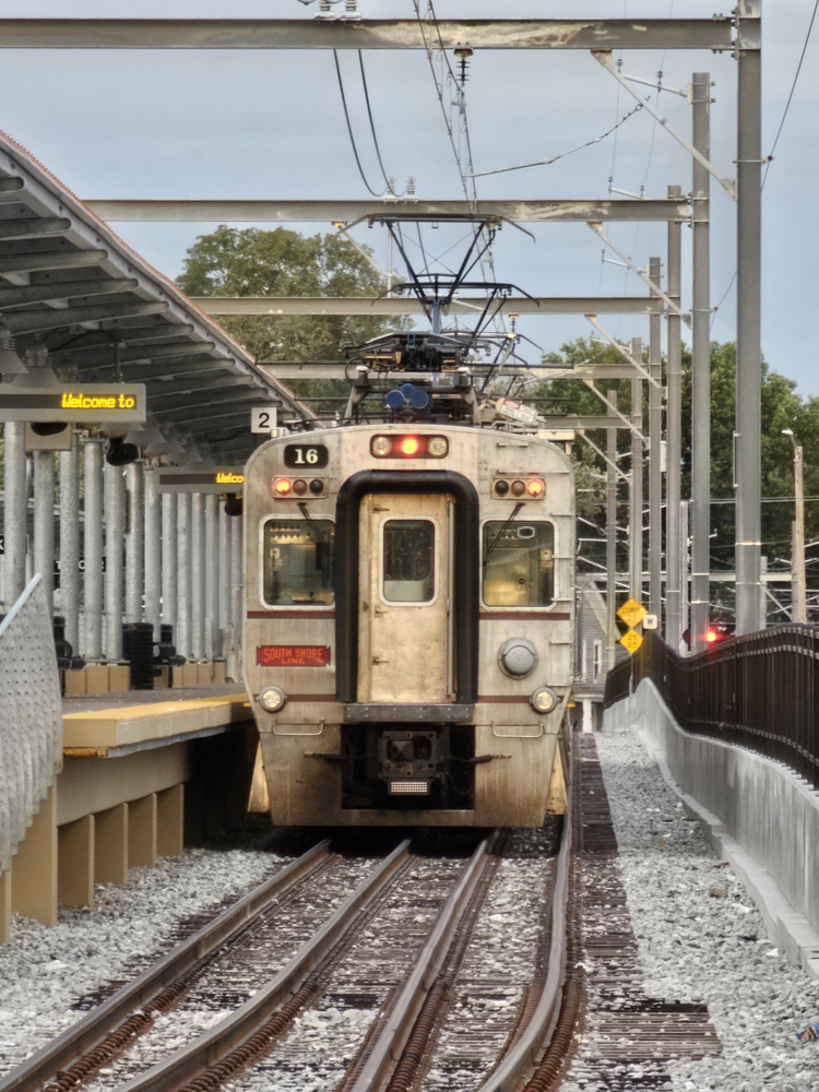 Front view of electrified train at station platform