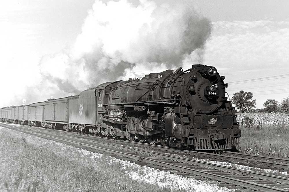 Steam Chicago & North Western locomotives with speeding train