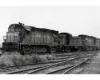 Dirty Chicago & North Western locomotives on freight train