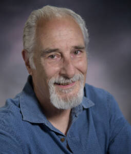 Man with beard and blue shirt